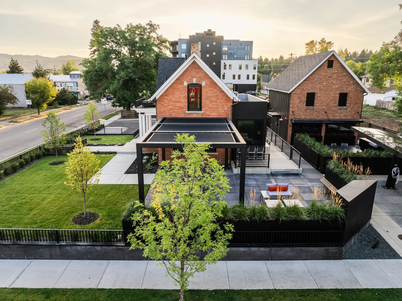 Both estate buildings and private grounds in warm evening light
